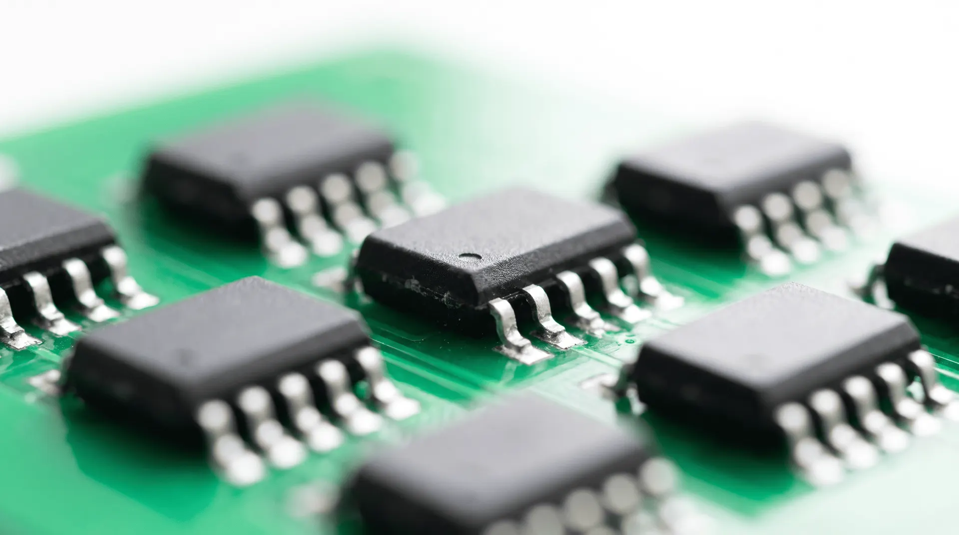 Macro of black integrated-circuit chips on a printed circuit board
